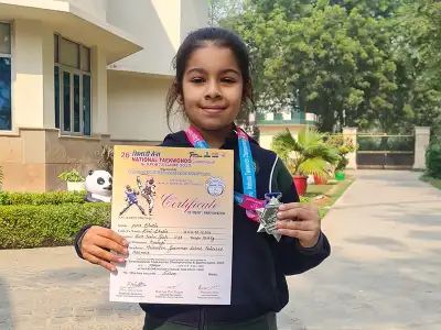 Yana Sharma with her National Taekwondo Championship award