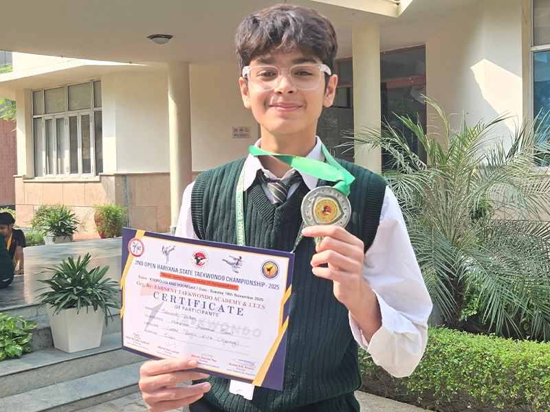 Shaunak Dubey with his Haryana State Taekwondo Championship award
